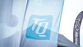 TQ logo on a flag