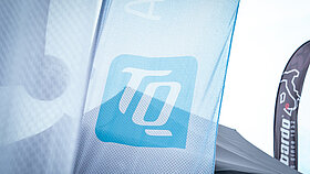 TQ logo on a flag